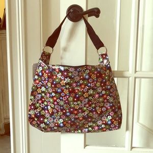 Floral print vinyl Hobo type purse.